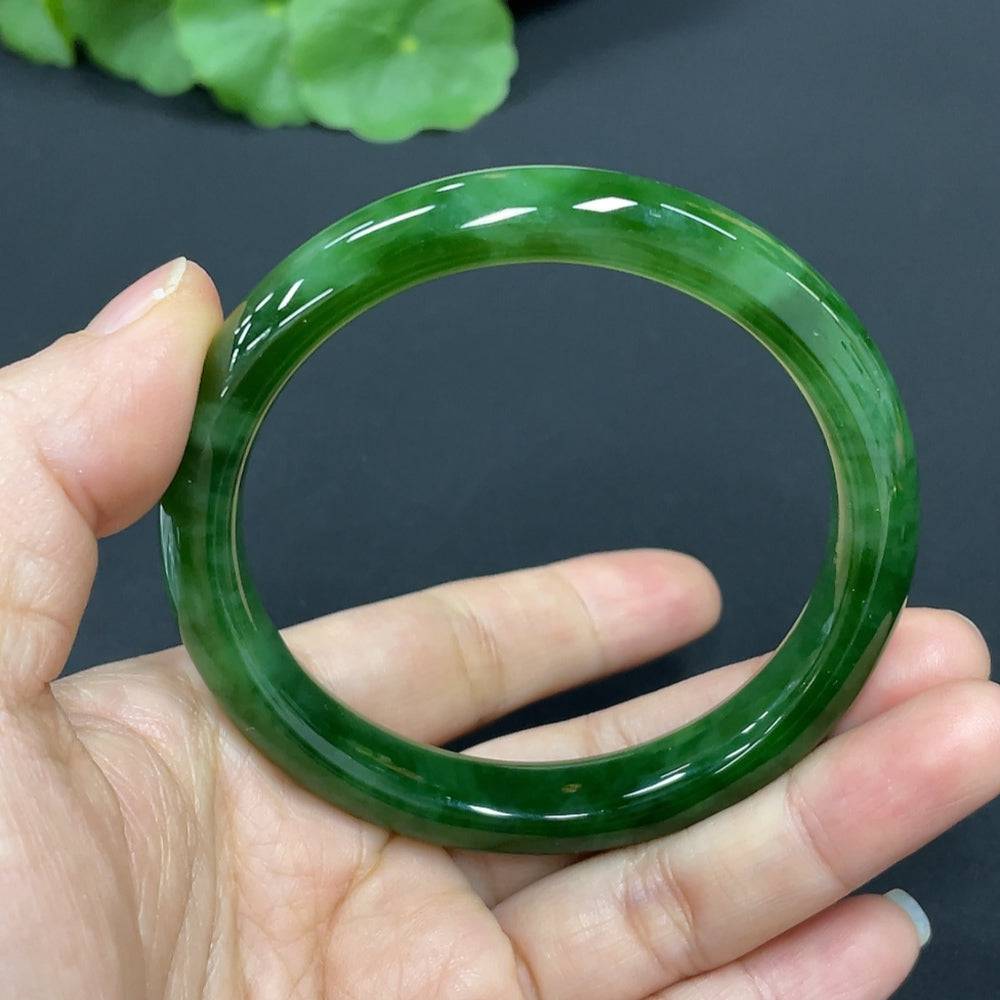 Huiliu certified Hetian jade round bracelet with smooth, polished jade beads on a string, displayed on a neutral background.