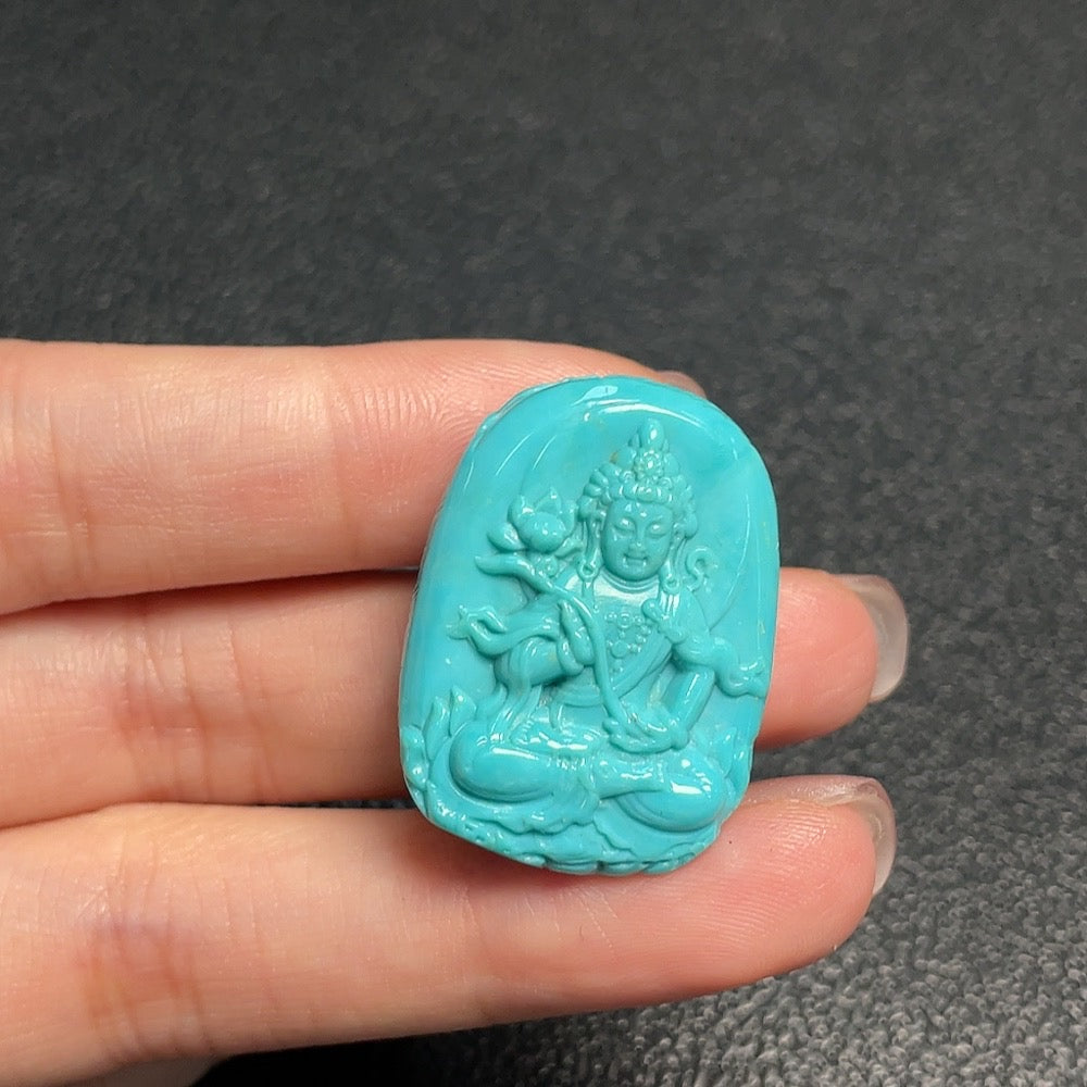 Turquoise gemstone pendant from HUILIU HQ, weighing approximately 10.2 grams, featuring vibrant blue-green hues and polished surface.