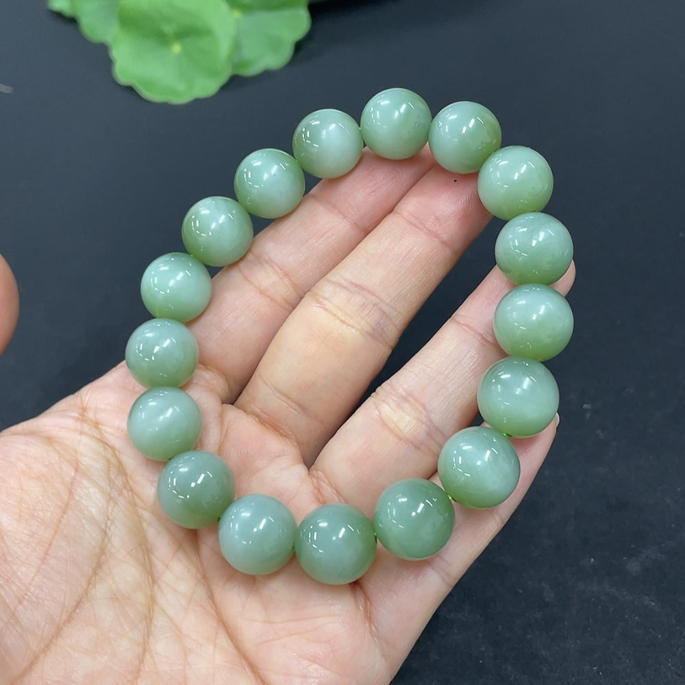 HKHQ Hetian Jade bracelet with 11.6mm beads, weighing approximately 43g, featuring smooth, polished jade stones.