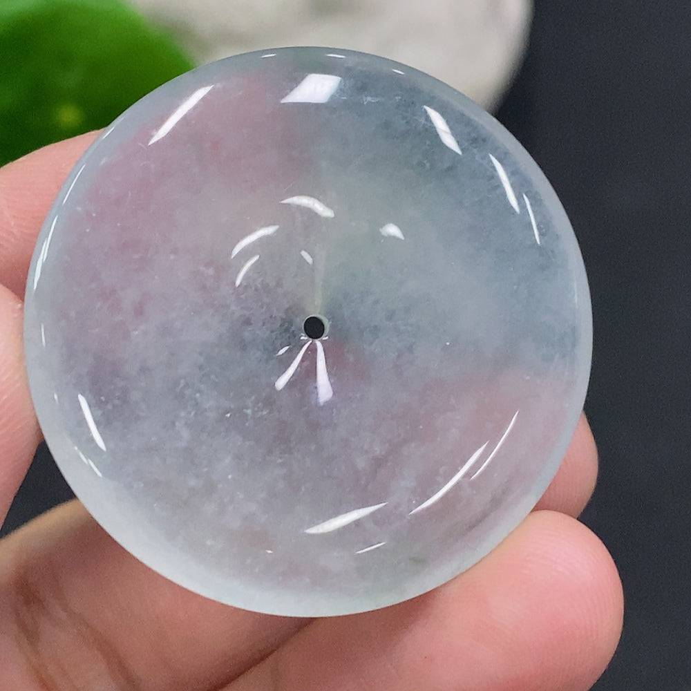 JadeitePeace button from HUILIU HQ, carved jade jewelry piece with a smooth polished surface and intricate design.