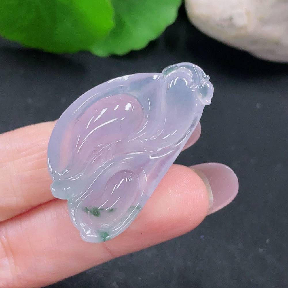 Huiliu certified jadeite pendant featuring smooth, polished jade with natural green hues and intricate carving details.