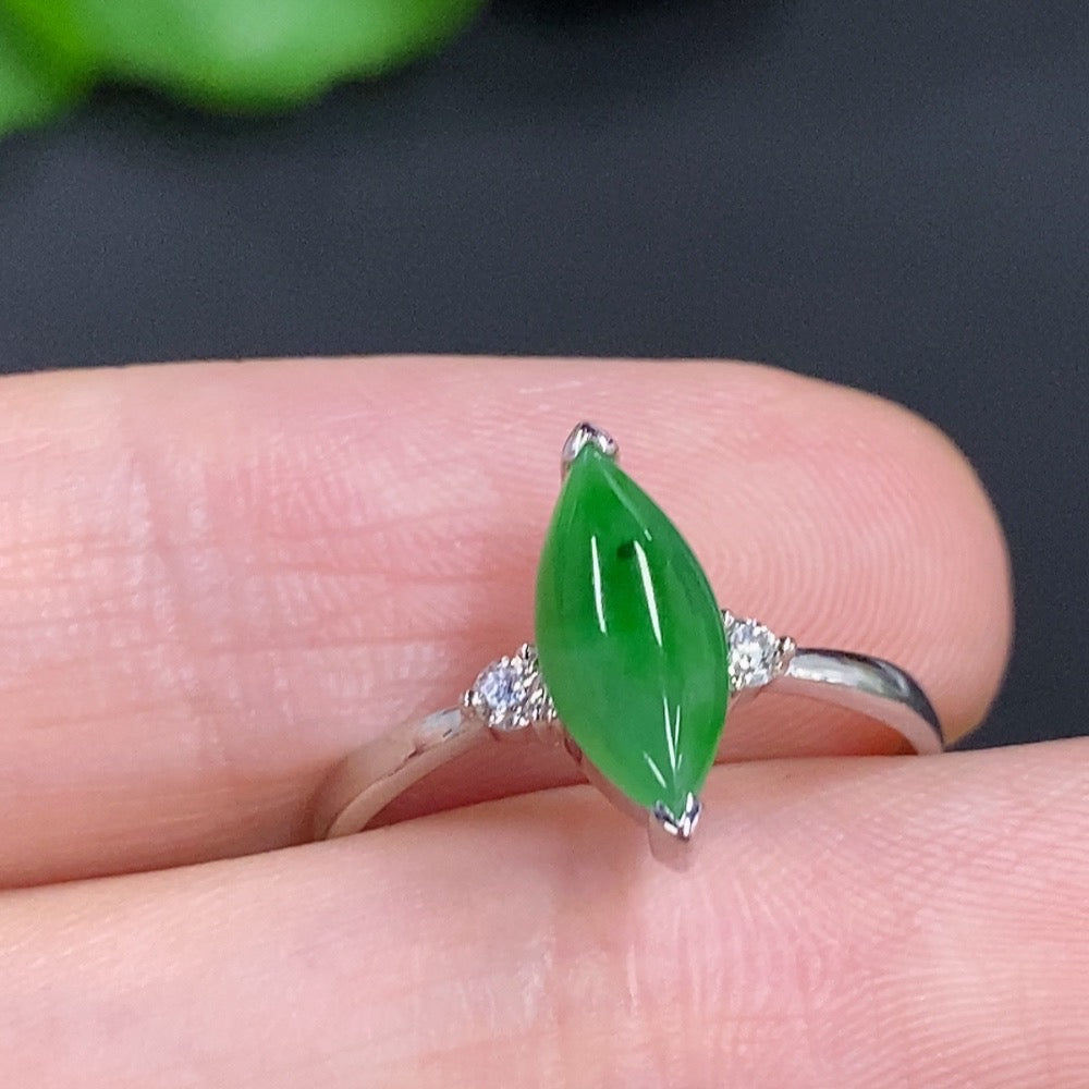 Jadeite freeform ring in 18K gold with diamond accents, elegant jewelry piece featuring smooth jadeite and sparkling diamonds.