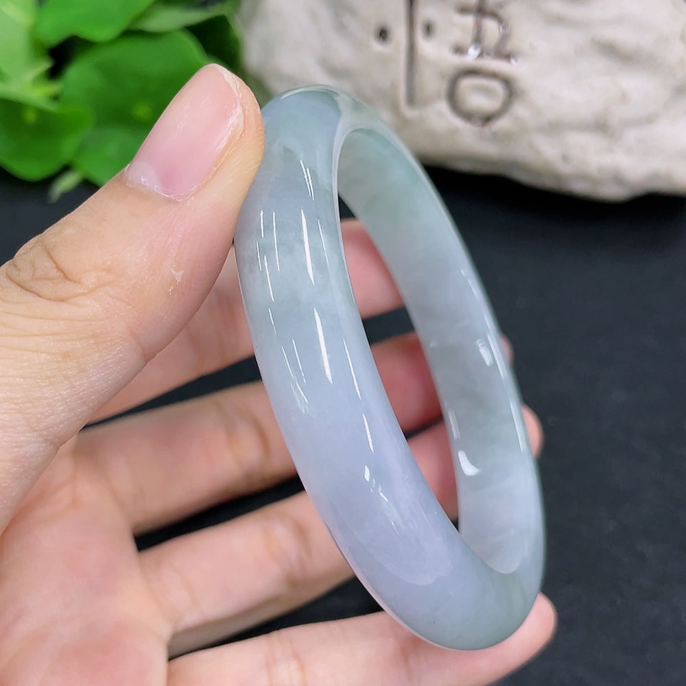 HKHQ jadeite round bangle in size 58, showcasing smooth green jadeite with a polished finish, weighs 56.1 grams.