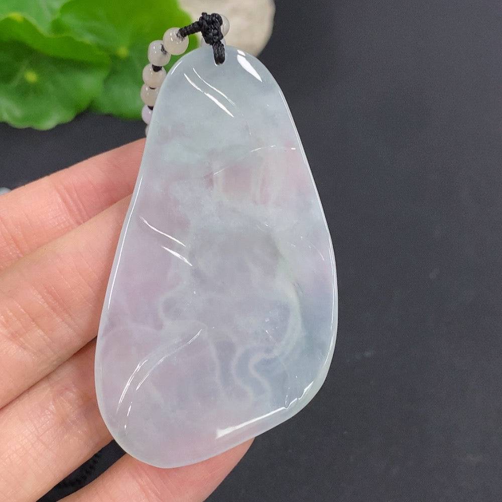 Jadeite Samantabhadra Bodhisattva pendant with intricate carvings, crafted from smooth green jade, showcasing detailed Buddhist iconography.
