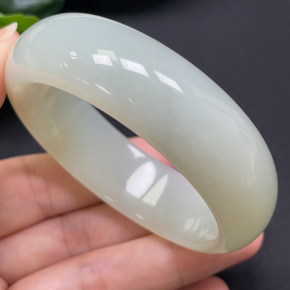 HKHQ Hetian Jade round bracelet, 52mm size, weighing approximately 60.95g, featuring smooth, polished jade beads.