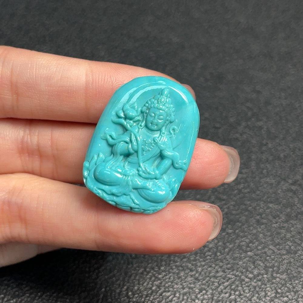 Turquoise gemstone pendant weighing approximately 10.2g, crafted by HUILIU HQ, featuring vibrant blue-green hues and polished finish.