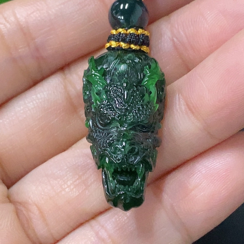 Huiliu Jadeite pendant featuring a carved dragon plaque with rope attachment, crafted from green jade for elegant jewelry.