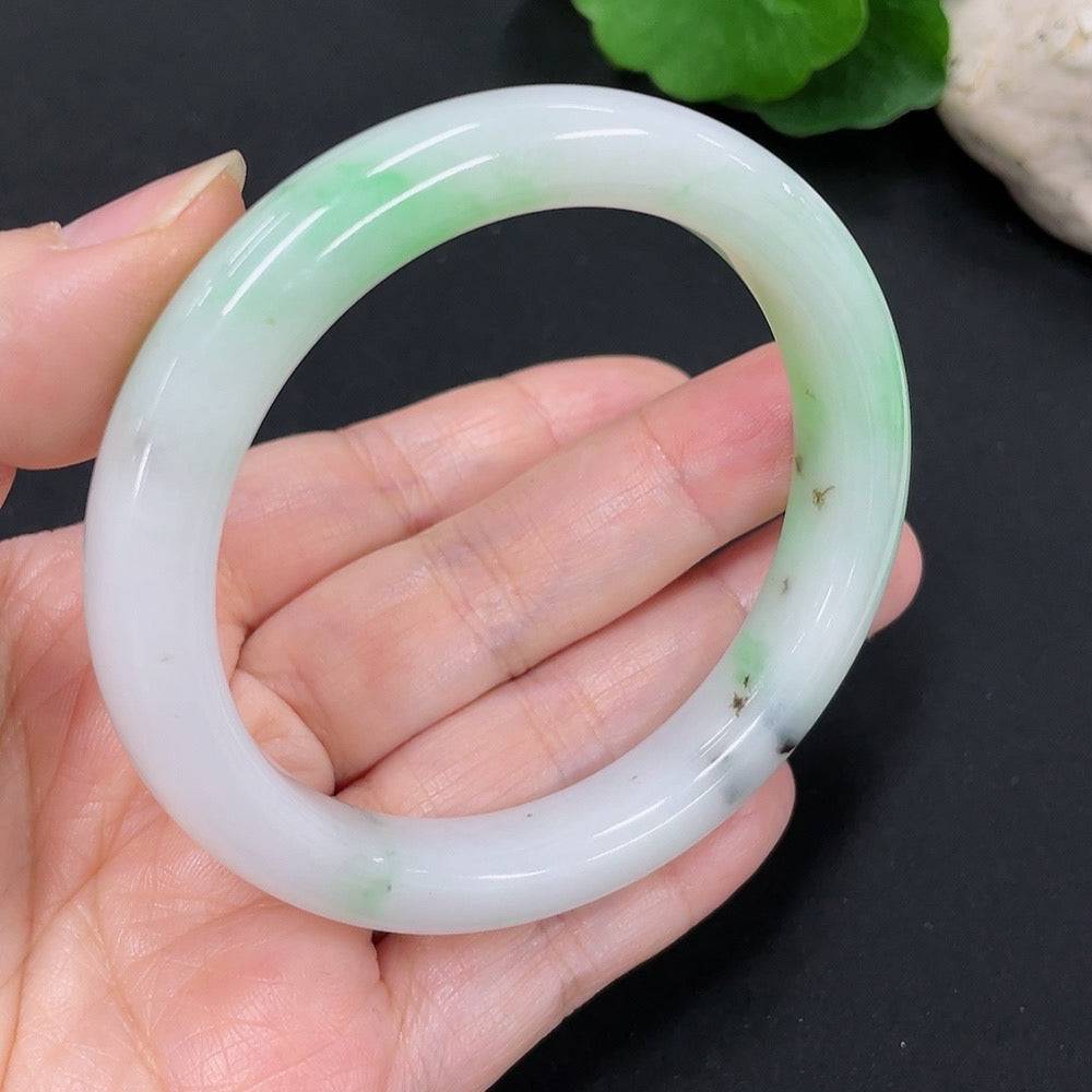 Huiliu certified jadeite round bangle showcasing smooth, polished jade with a glossy surface and elegant circular design.