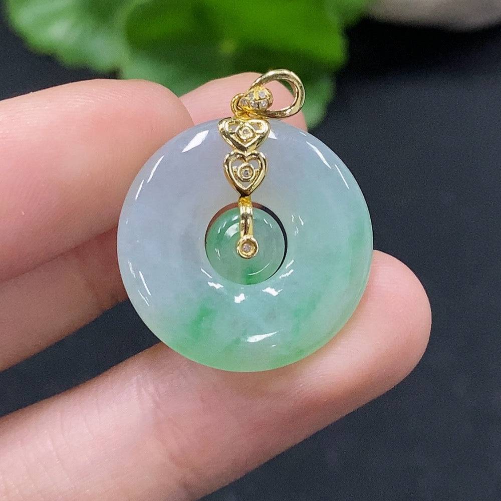Jadeite mother-and-son button pendant with 18K gold and diamond accents, featuring intricate inlay work and a polished finish.