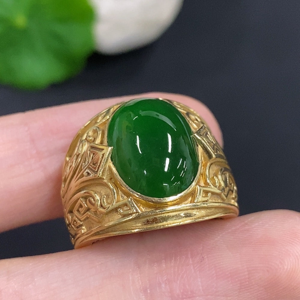 Elegant jadeite cabochon ring with 18K gold band from HKHQ, showcasing a smooth, polished jadeite gemstone set in a stylish ring.