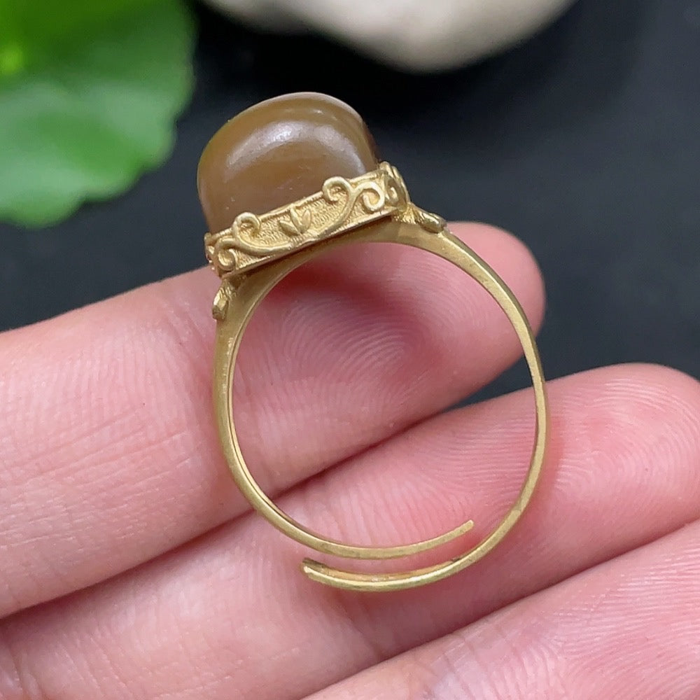 Hetian jade open-ended ring by HUILIU HQ featuring 18k gold accents and diamond details, showcasing the elegant jewelry design.