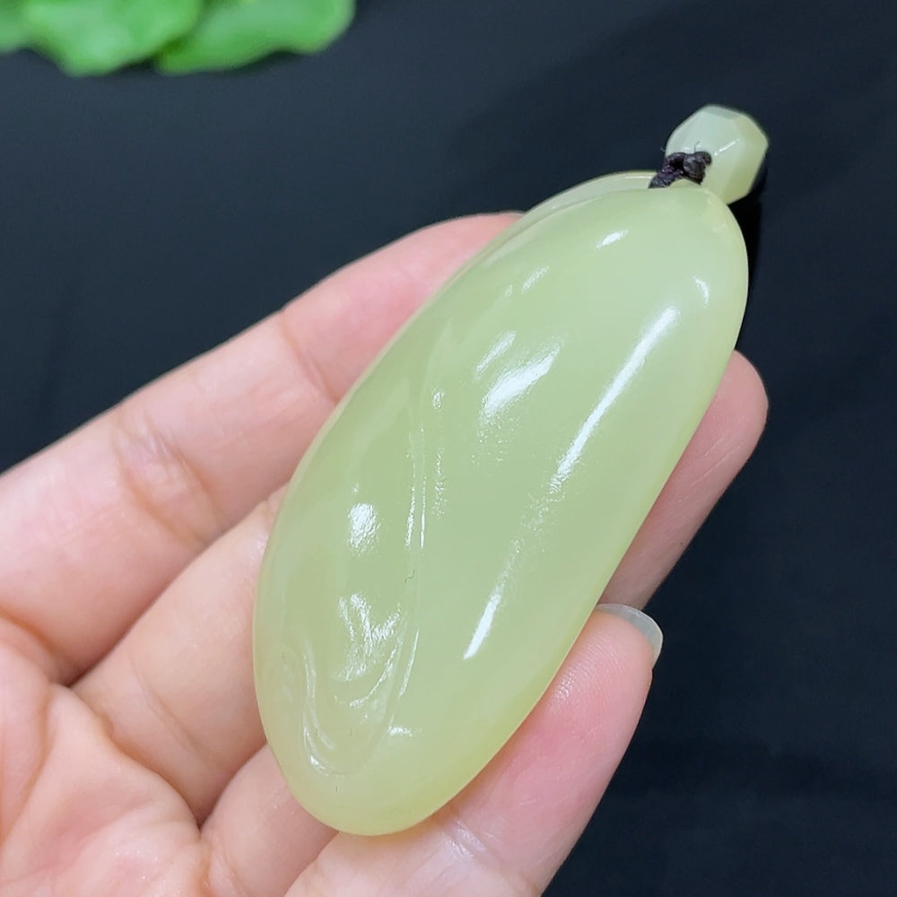 Hetian Jade freeform pendant necklace by HKHQ showcasing smooth, polished jade with a natural shape and elegant design.