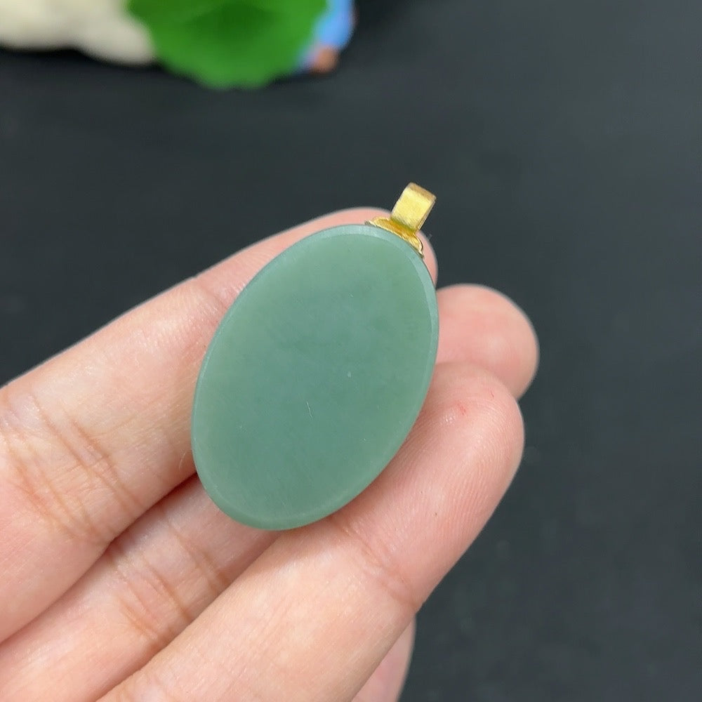 Hetian Jade inlaid pendant with 18k gold, weighing approximately 12.7g, featuring intricate craftsmanship and elegant design.