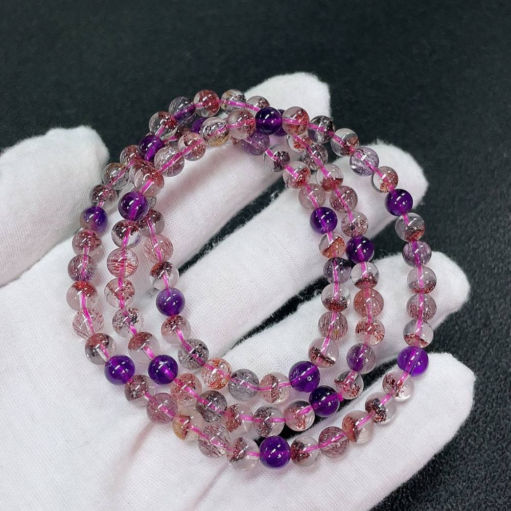 Huiliu certified gemstone crystal bead strand with 6.1mm round beads, showcasing a sparkling, translucent gemstone jewelry component.
