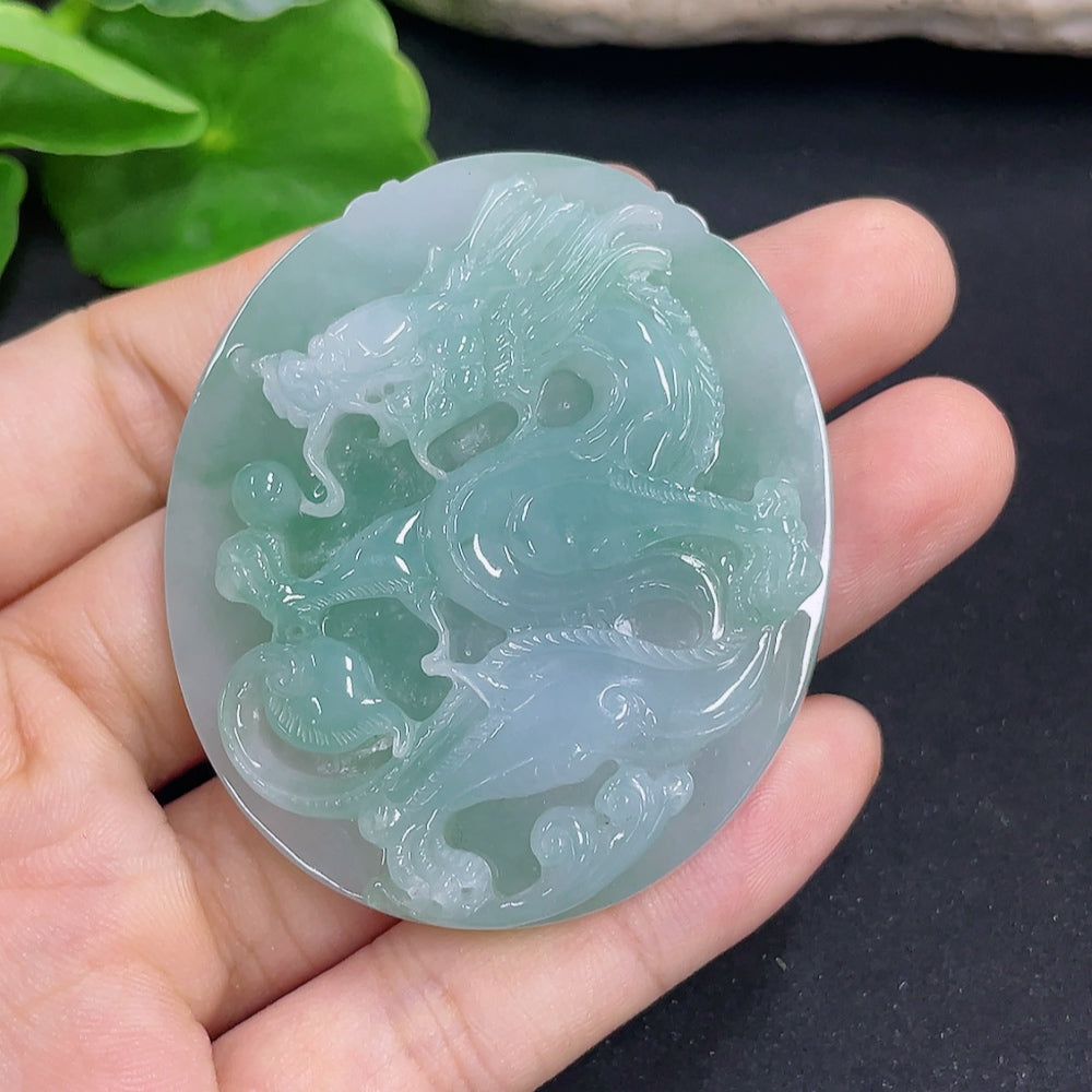 Jadeite dragon pendant necklace from HKHQ, showcasing a detailed green jadeite dragon design on a silver chain.