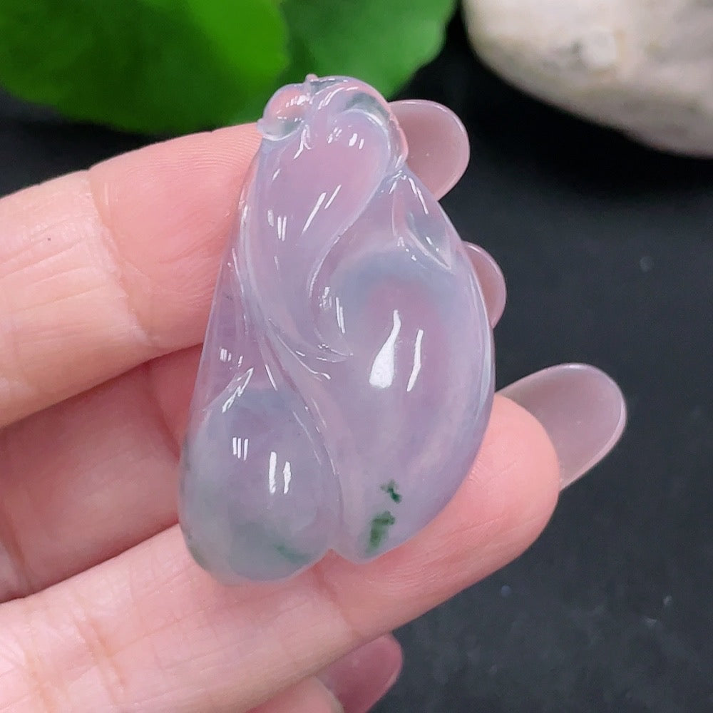 Huiliu certified jadeite pendant featuring smooth, polished jade in a natural green color on a plain background.