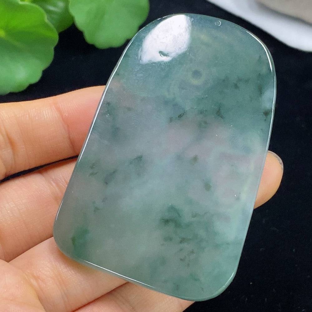 Jadeite Guanyin pendant from HUILIU HQ showing detailed carvings and a polished jade surface, weighing approximately 39.33 grams.