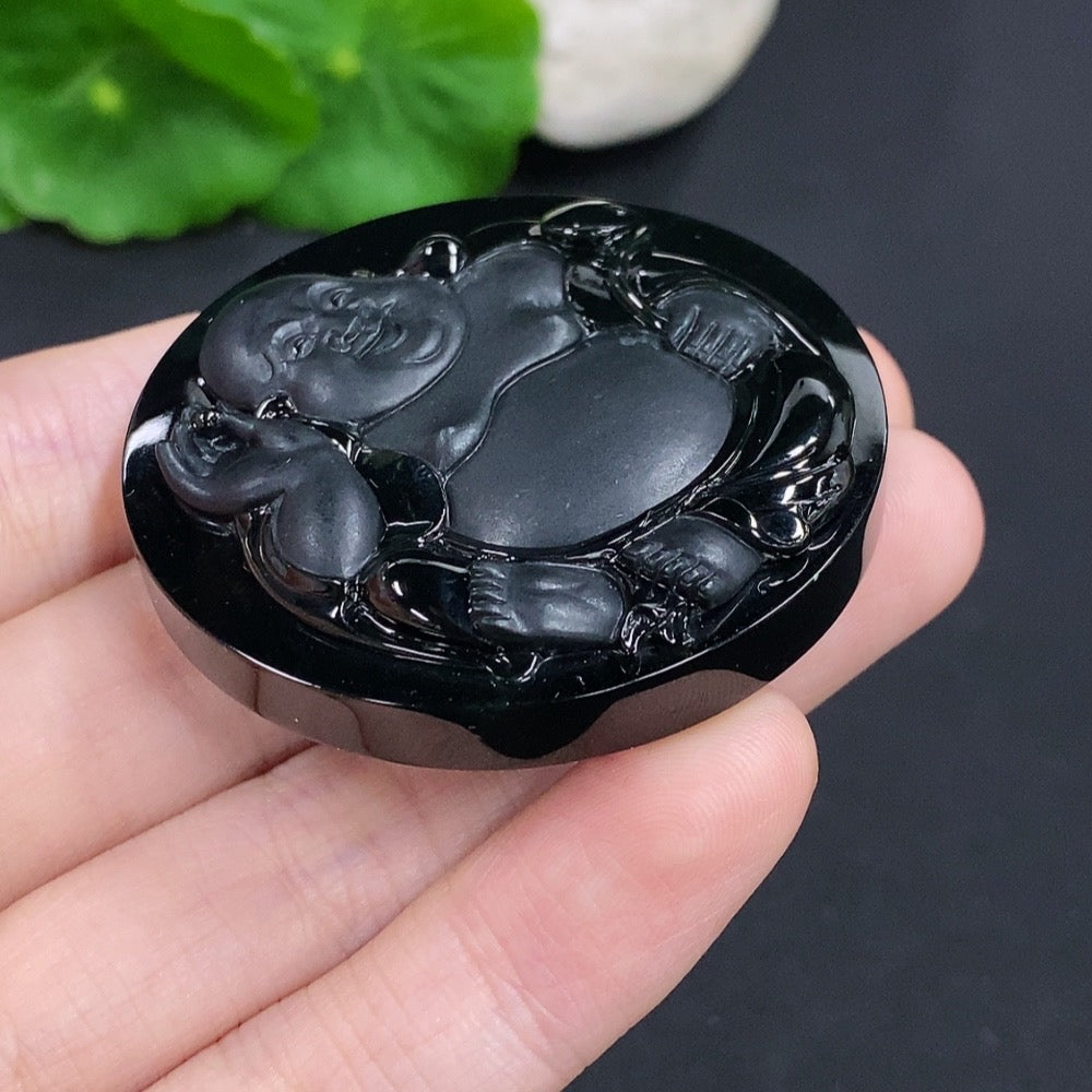 Jadeite Buddha pendant from HKHQ, weighing about 44.6g, featuring a detailed carved Buddha figure on smooth green jade.