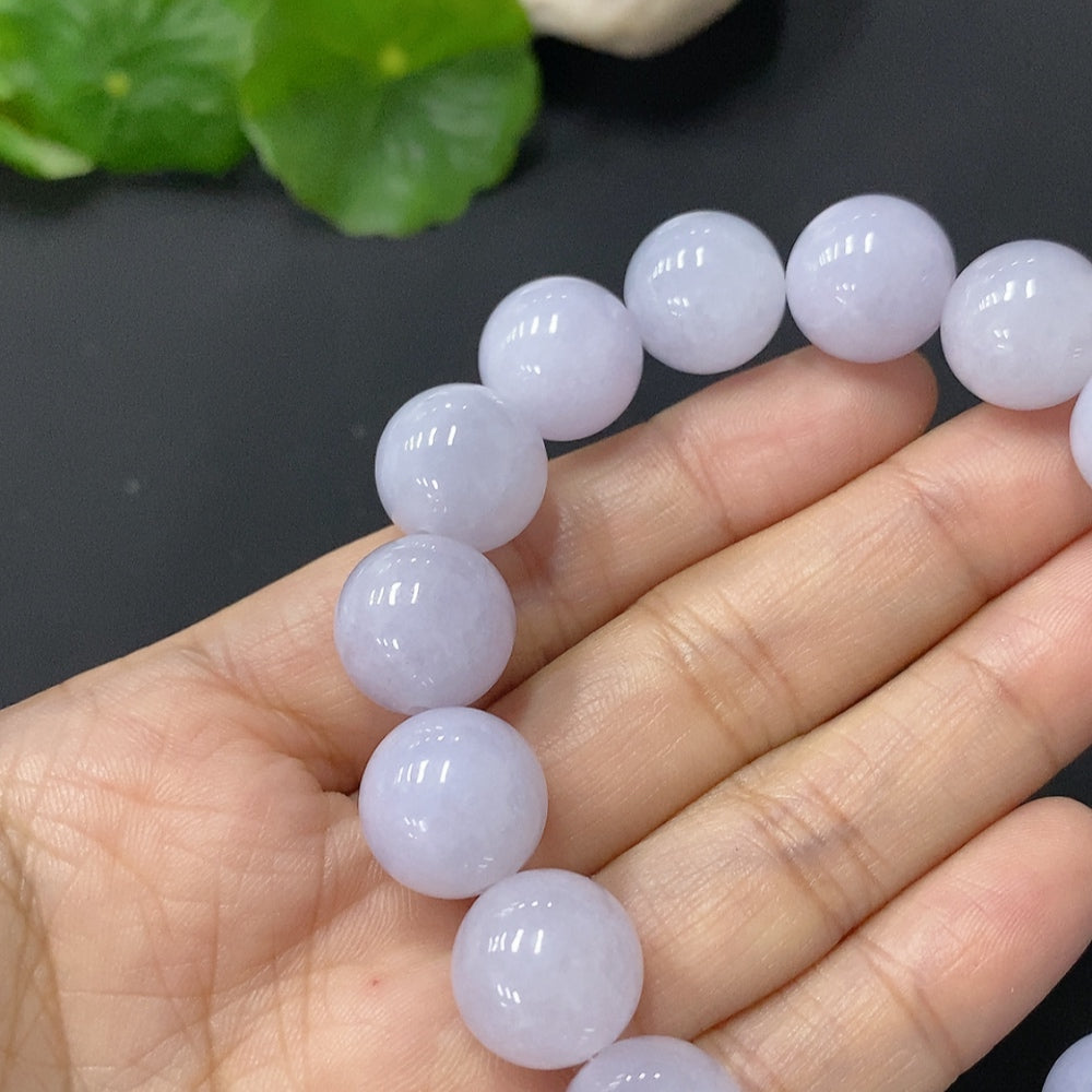HUILIU HQ Jadeite bracelet with 12.8mm beads, approximately 55g, showcasing smooth, polished green jade beads.