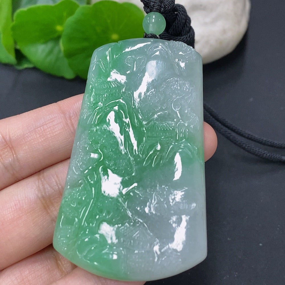 Jadeite pendant with landscape design and cord, weighing approximately 36.4g, crafted by HKHQ.