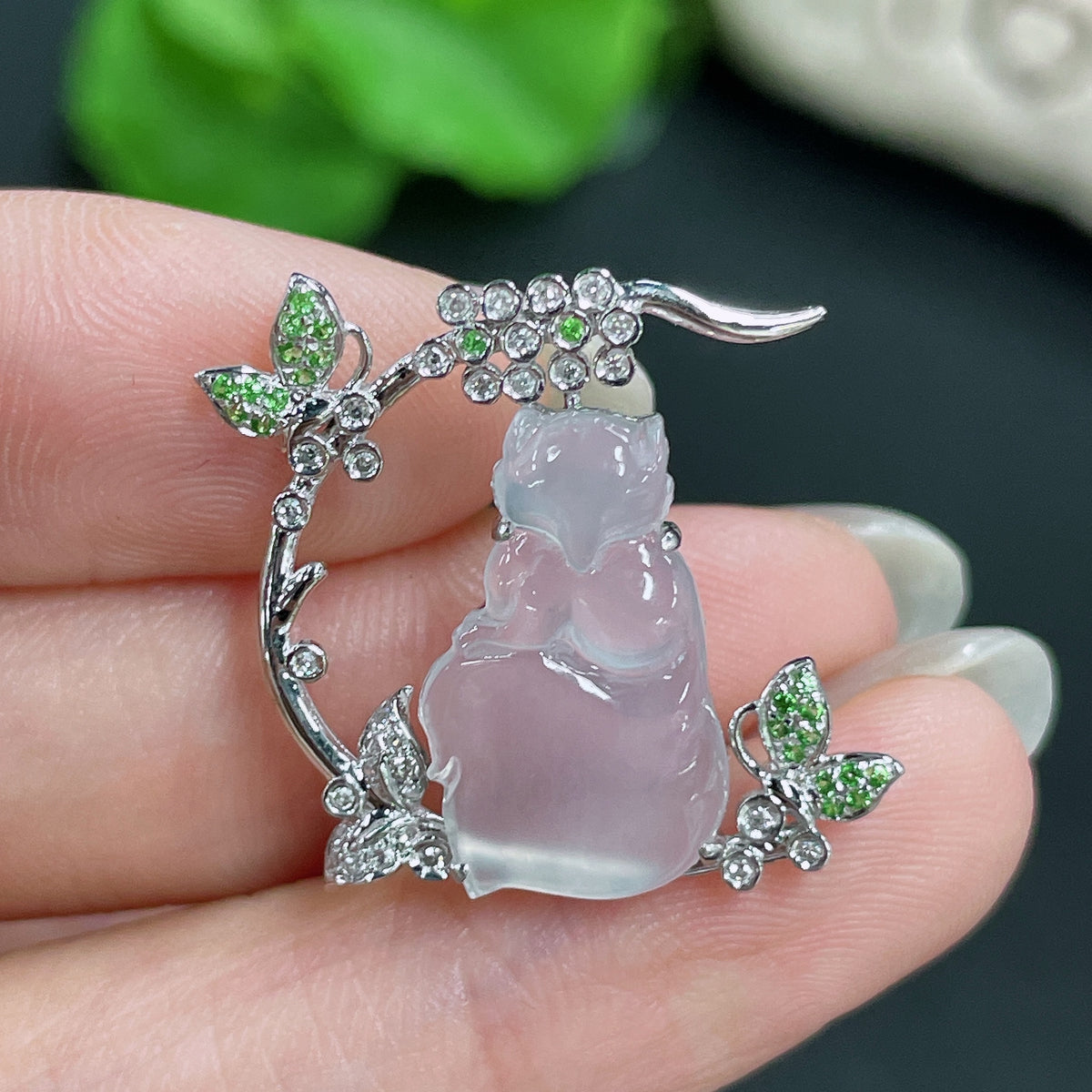 Jadeite pendant set in 18k gold with diamonds, featuring a polished jade stone and intricate gold detailing, weight approx. 3.05g.
