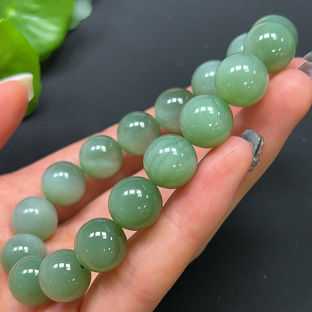HKHQ Hetian Jade bracelet with 11.8mm beads, weighing approximately 44.38g, showcasing smooth, polished green jade stones.