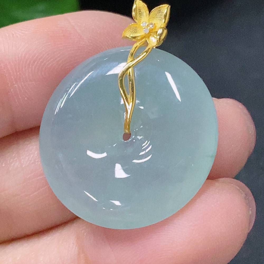 Jadeite pendant with peace knot design, 18K gold accents, diamond details, from HUILIU HQ, showcasing the elegant jewelry piece.