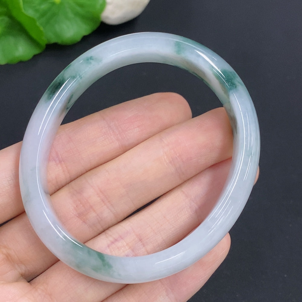 Jadeite Concubine bracelet by HKHQ featuring green jade stones, size 55.5/47.5, weighing approximately 38g.