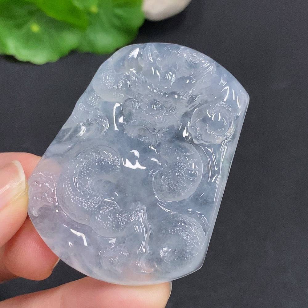 Jadeite Dragon pendant by HUILIU HQ featuring a soaring dragon design, crafted from polished green jade stone.