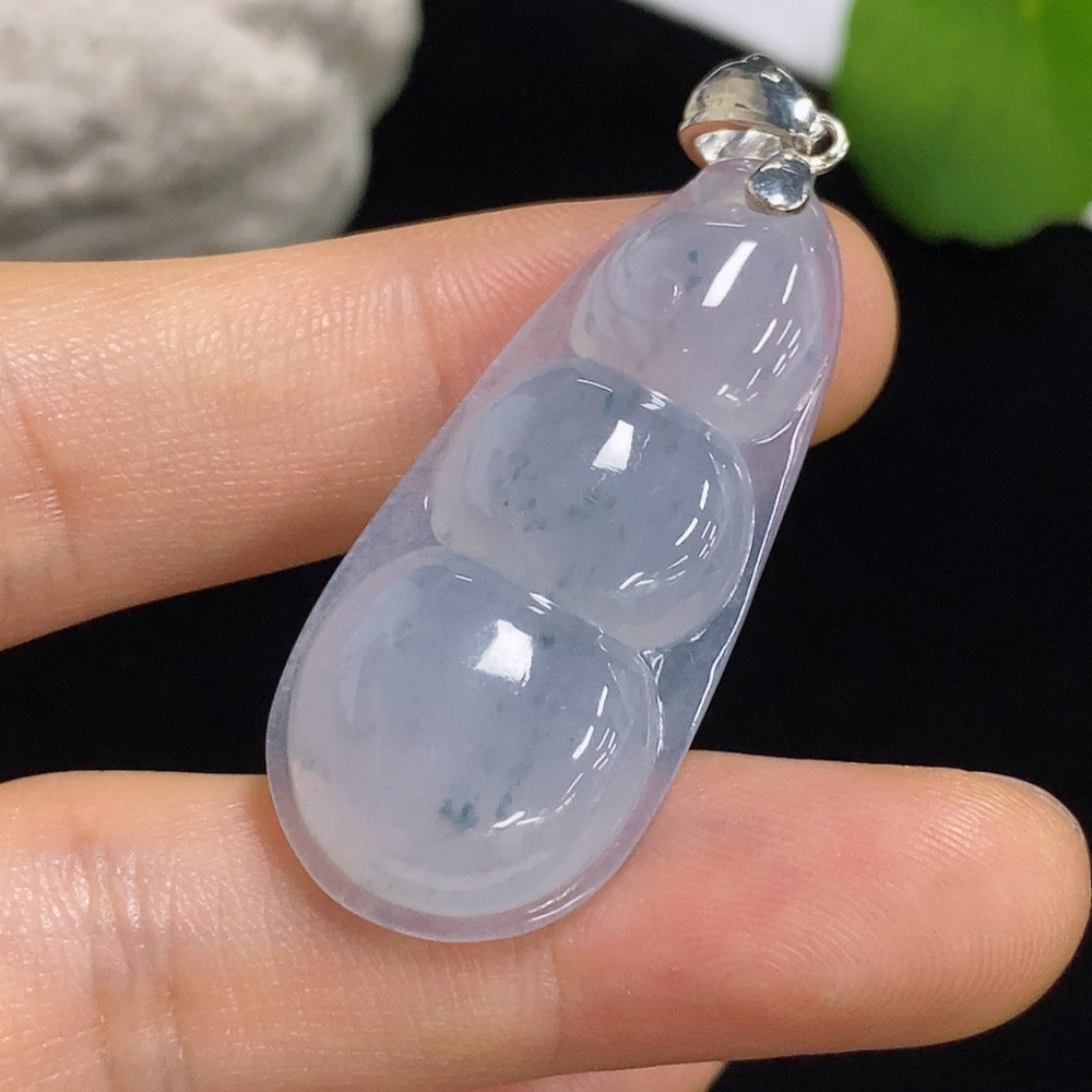 Jadeite lucky bean pendant necklace by HKHQ featuring a smooth green jadeite bead on a simple string.