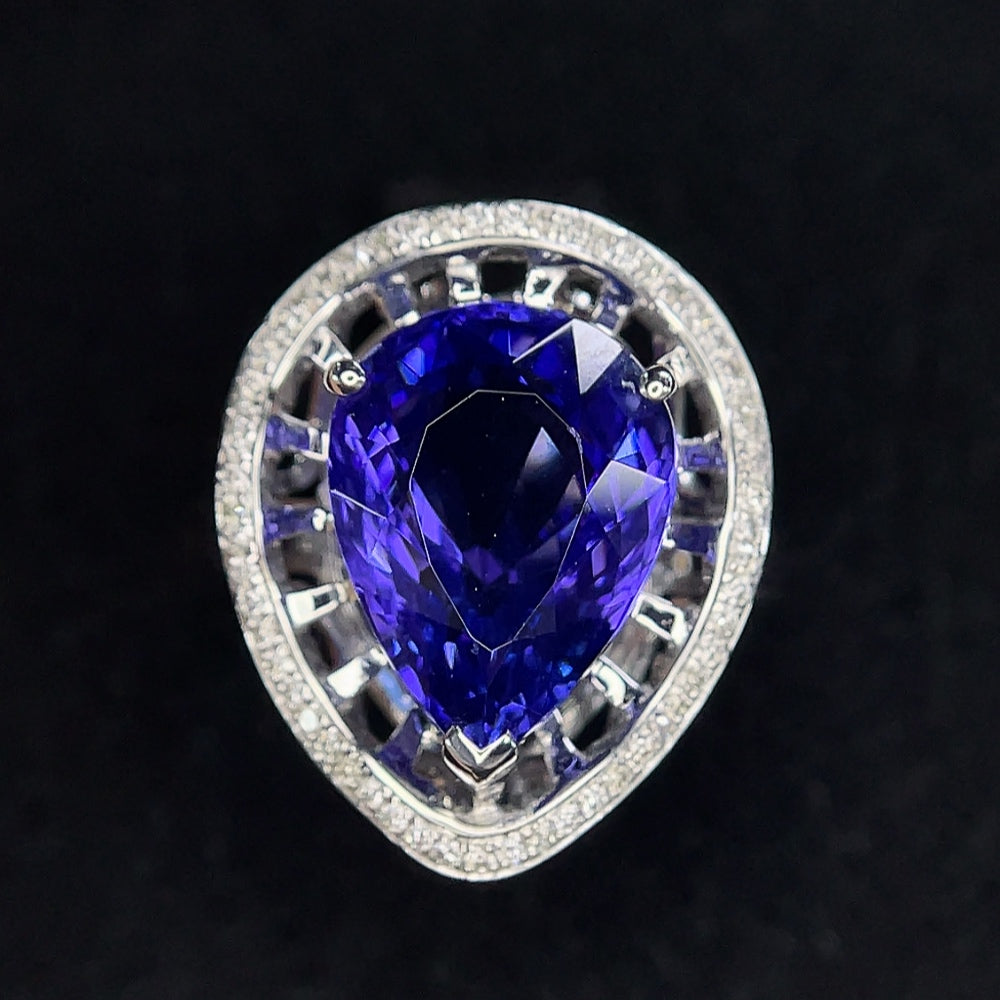 18K gold Tanzanite ring with diamond accents, size 11, featuring vibrant blue gemstones and sparkling diamond details.