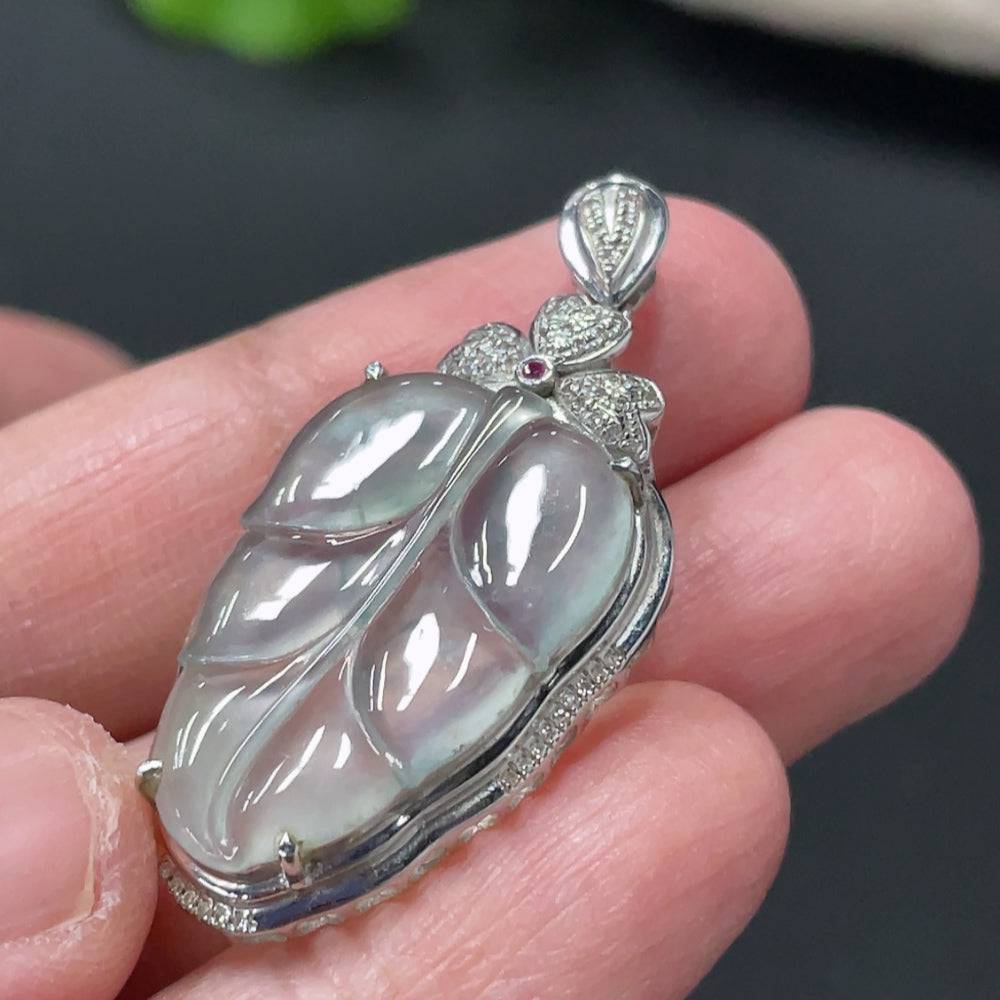 Jadeite leaf inlay pendant with 18K gold inlay and diamond accents, featuring a natural jade jadeite stone and intricate leaf design.