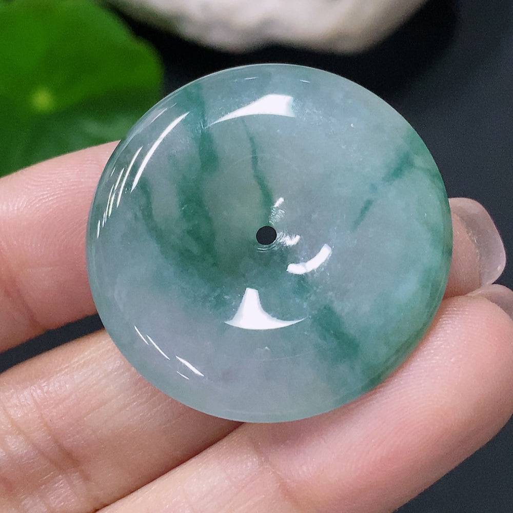 Jadeite pendant with peace knot design, crafted from green jade, weighing approximately 9.58 grams, by HUILIU HQ.