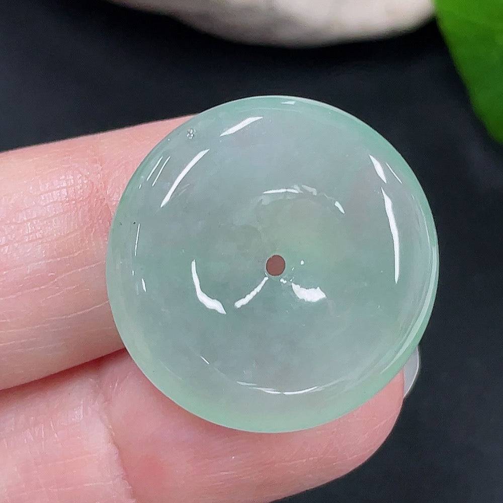 Jadeite Peace Knot Pendant by HUILIU HQ, showcasing a smooth, polished jade pendant with intricate knot design on a neutral background.