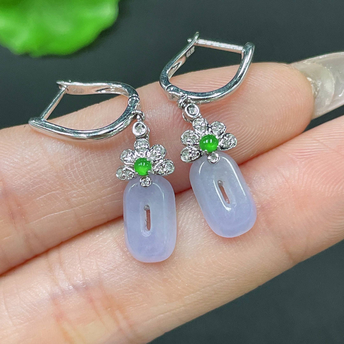 Huiliu jadeite earrings with diamond accents, tested and certified, featuring elegant jade jewelry design on a white background.