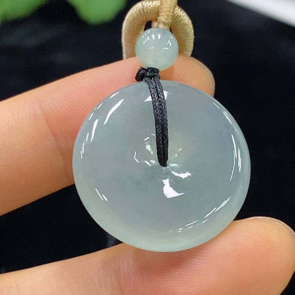 Huiliu Jadeite Safety Buckle Pendant with rope weight, crafted from green jade, featuring a smooth, polished surface and traditional design.