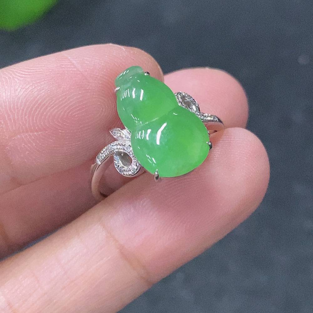 Huiliu Jadeite inlaid ring with diamond accents, featuring a polished jade gemstone and intricate metalwork design.