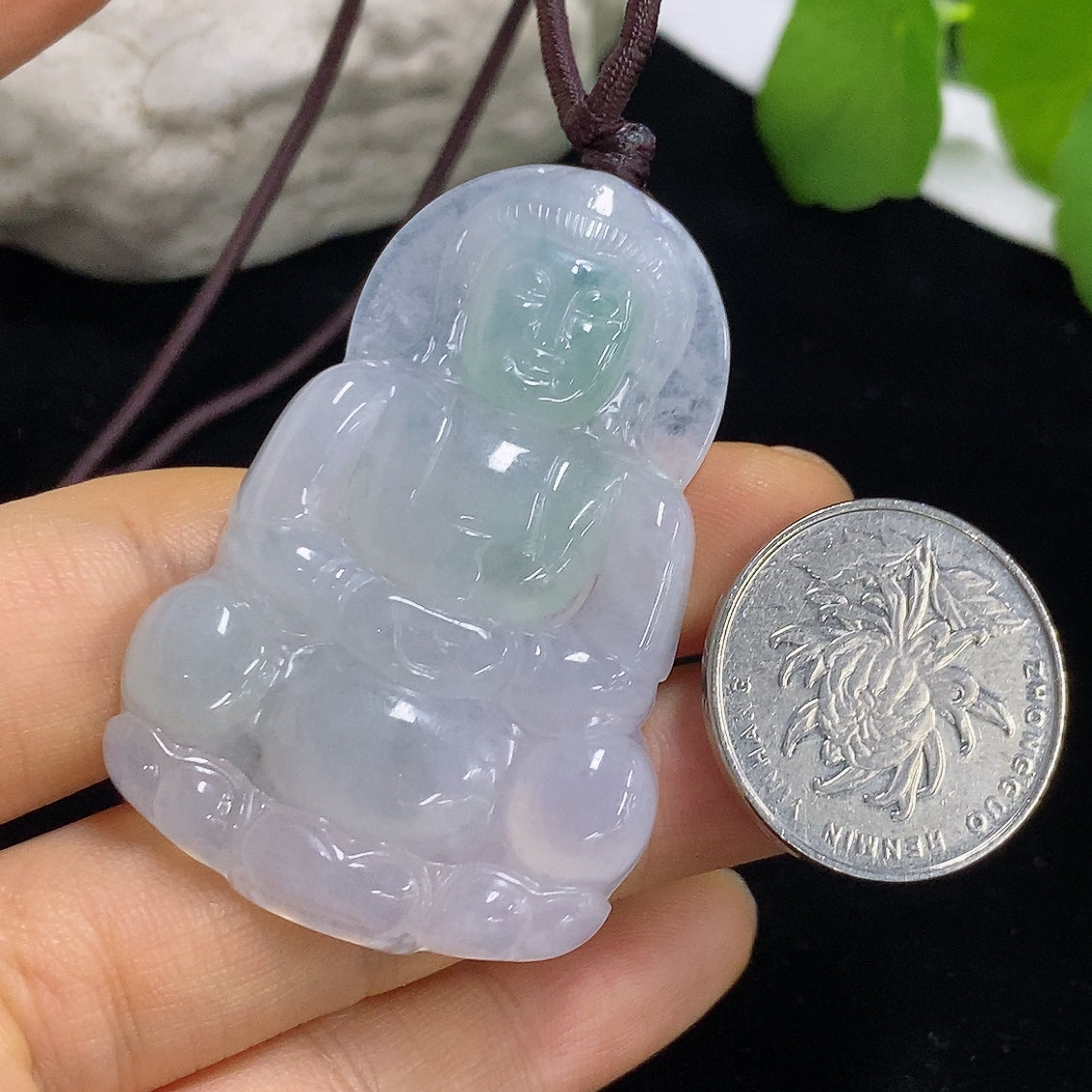 Jadeite Guanyin pendant with intricate carvings, weighs approximately 21.6g including rope, crafted by HKHQ.