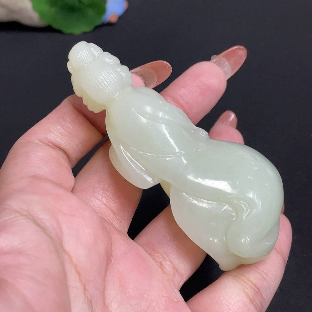Hetian Jade handheld piece by HUILIU HQ showcasing intricate craftsmanship and natural jade beauty, weighs approximately 76.4g.