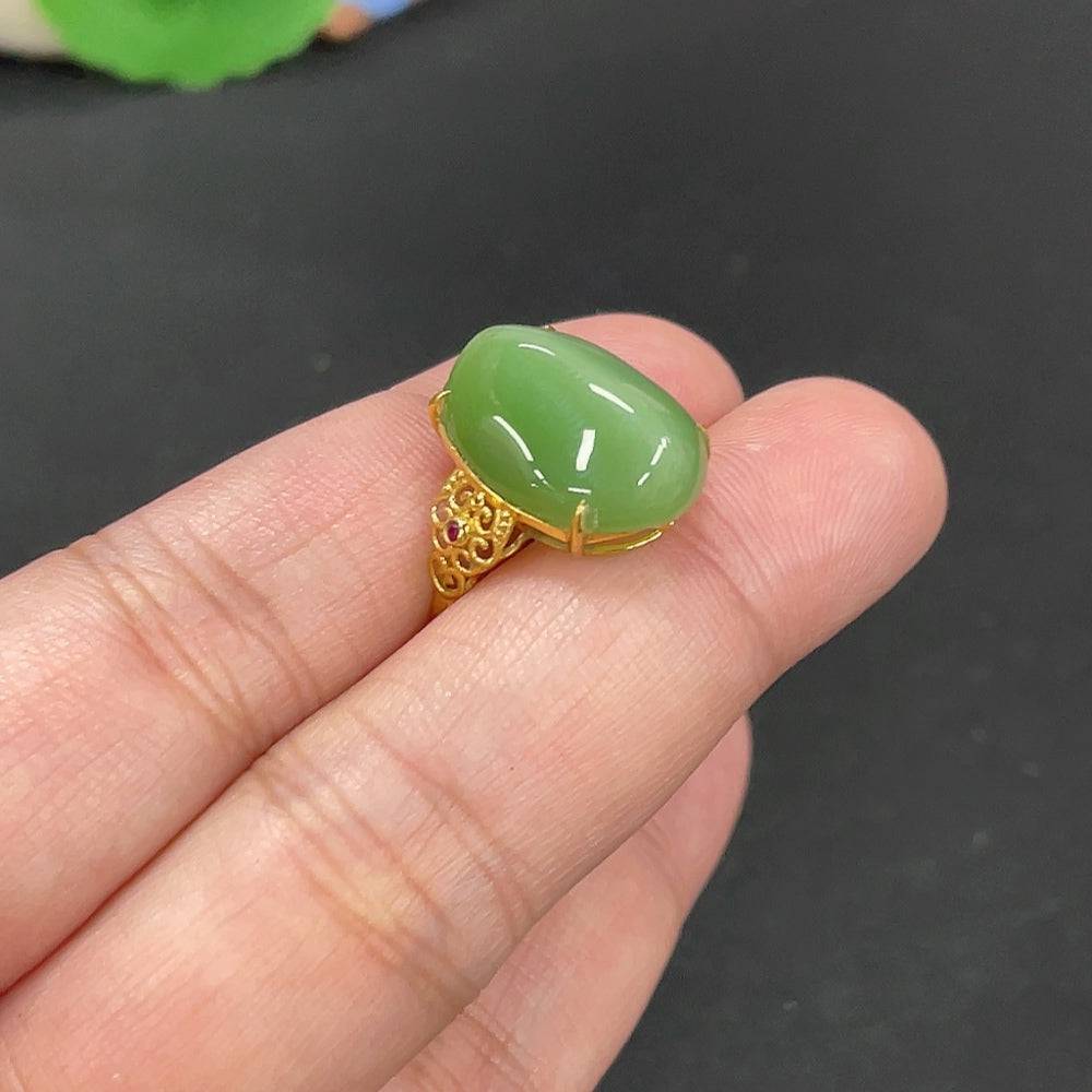 Hetian Jade inlaid ring with 18k gold band, size 15, featuring jade stone and intricate gold detailing, weighs approx. 3.5g.