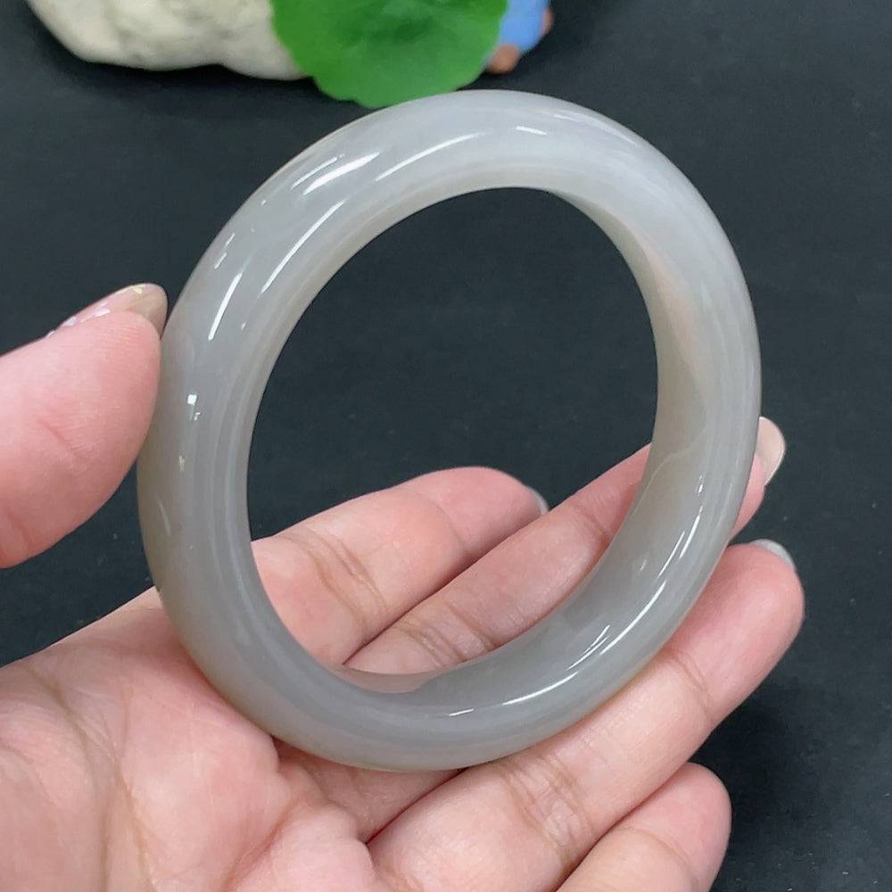 Huiliu certified Hetian jade round bracelet with smooth, polished jade beads on a delicate string.