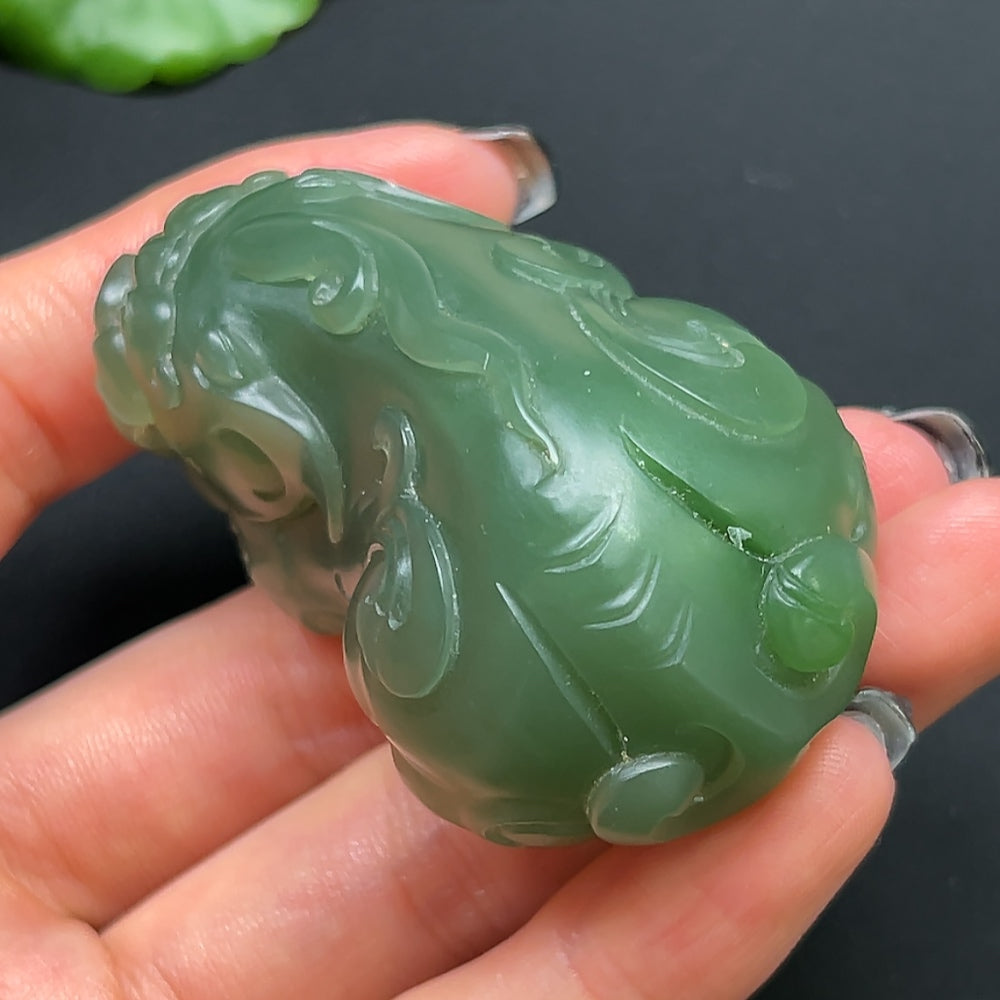 Hetian Jade Pixiu pendant necklace featuring a carved jade Pixiu charm on a delicate string, crafted by HKHQ.
