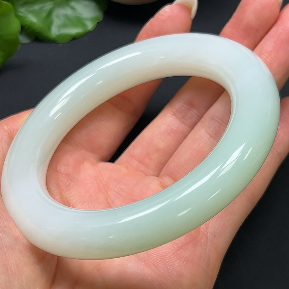 Hetian jade round bangle bracelet by HKHQ, size 61.5, weighing 96.73g, showcasing smooth, polished jade craftsmanship.