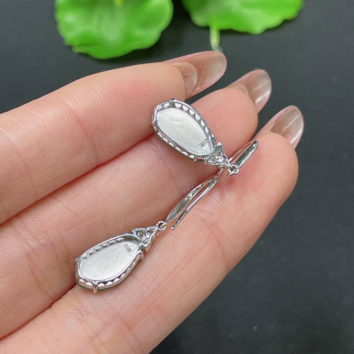 Jadeite earrings with 18k gold inlay and diamond accents, featuring a sleek design, from HUILIU HQ.