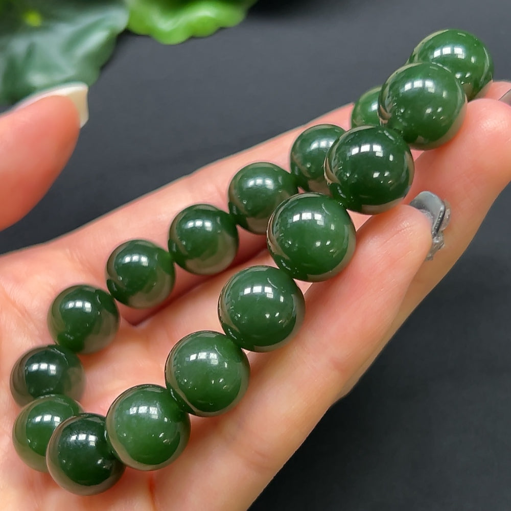 Hetian Jade bracelet with 12mm beads, weighing approximately 44.19g, showcasing smooth, polished jade stones.
