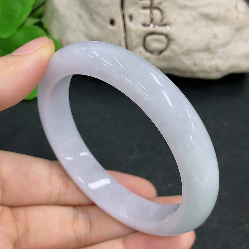 HKHQ jadeite round bangle in size 55.8 with a smooth, polished surface, weighing 52.4g, showcasing elegant green jadeite craftsmanship.