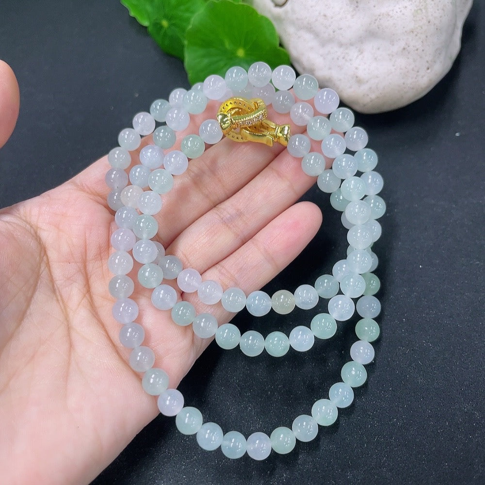 HKHQ jadeite bead necklace, non-gold, featuring smooth green jadeite beads, weighs 44.94g, displayed on a neutral background.