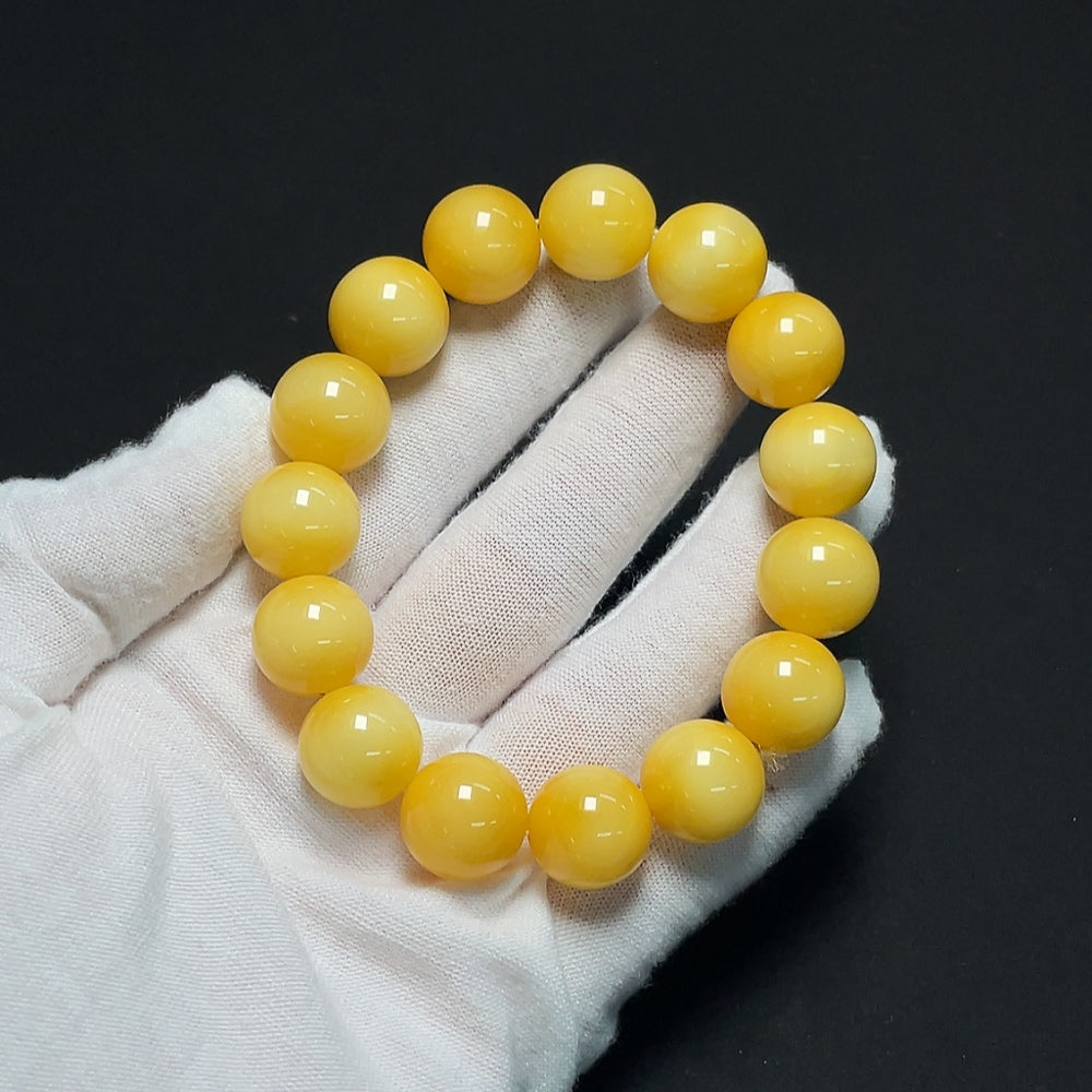Amber beeswax bracelet from HKHQ, featuring natural amber beads weighing 23.61g and measuring about 13.9mm in size.