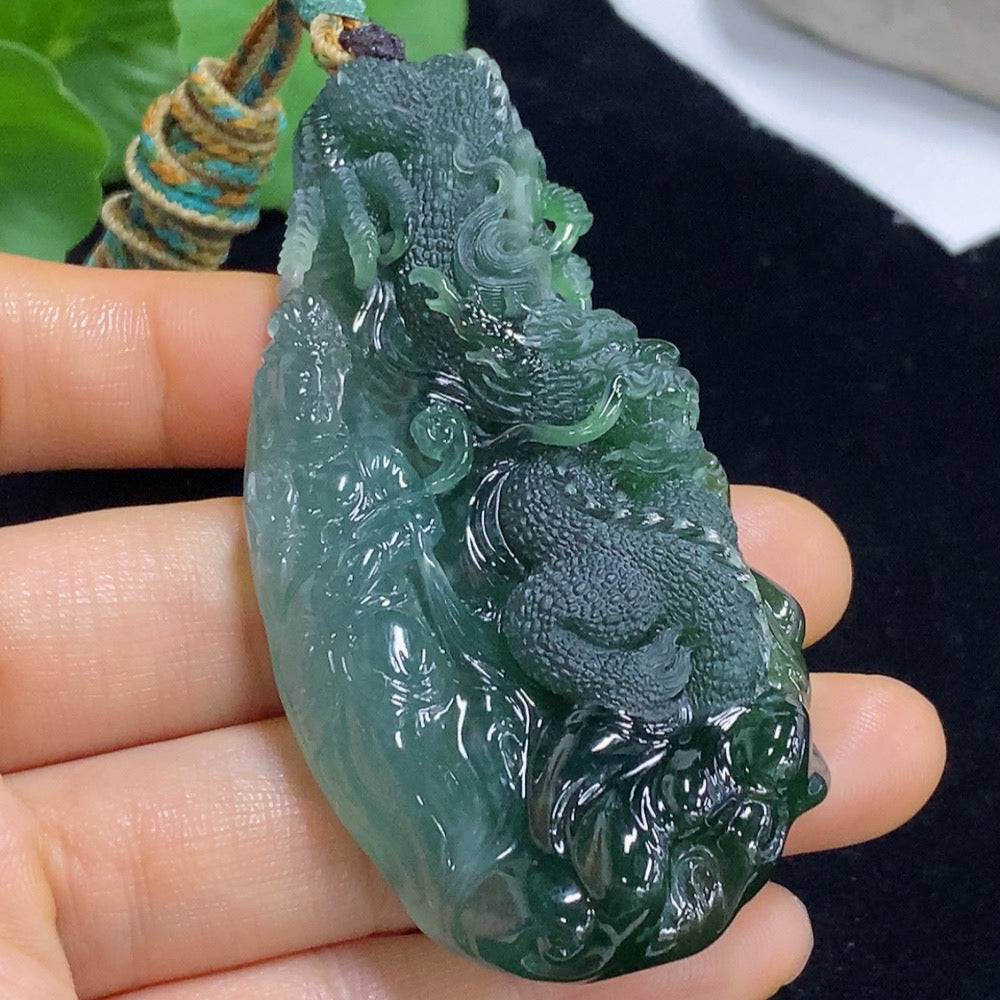 Jadeite pendant featuring a carved dragon plaque from HUILIU HQ, approximately 60g including rope, showcasing intricate jade carving.