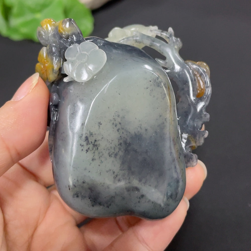Huiliu Hetian Jade butterfly and flower ornament with mineral inclusions, showcasing detailed craftsmanship and natural jade color.